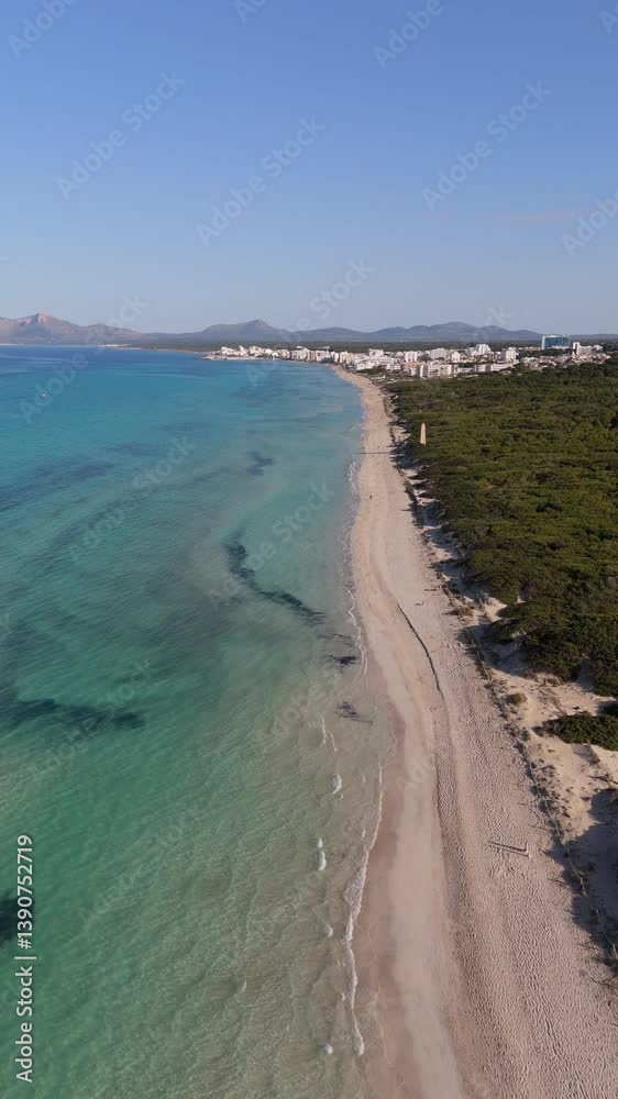 Vertical slow motion aerial view of paradise beach in Mallorca - Drone shot in slow motion flying over a turquoise beach on the Mediterranean coast - Concept of summer, beach and vacation
Vertical slow motion aerial view of paradise beach in Mallorca - Drone shot in slow motion flying over a turquoise beach on the Mediterranean coast - Concept of summer, beach and vacation