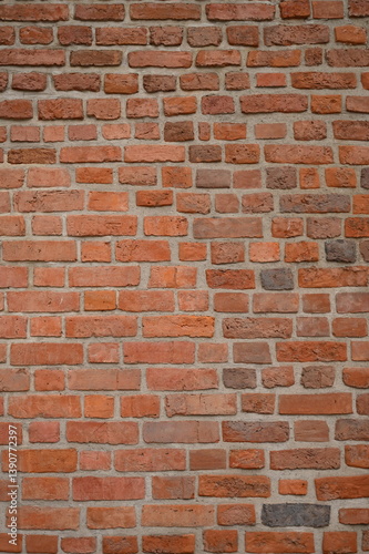 Red brick wall close up background. Vintage masonry texture of red bricks with mortar