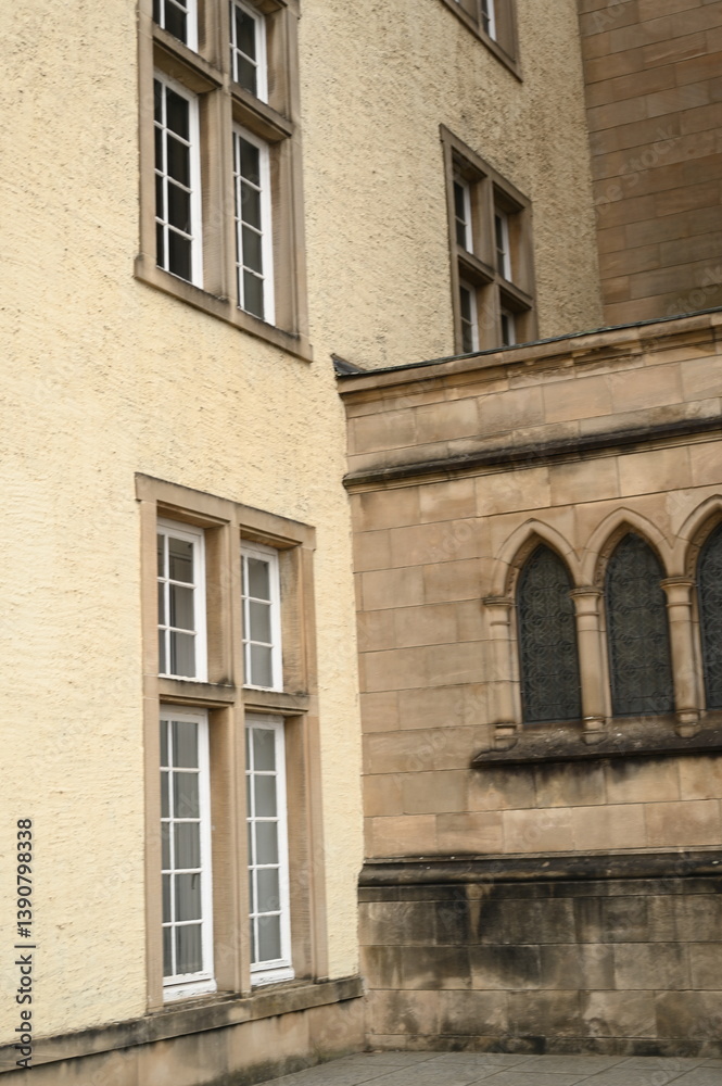 Naklejka premium Historic government building entrance in Luxembourg City. Elegant stone doorway with columns and arched wooden door — example of European architecture and civic heritage.