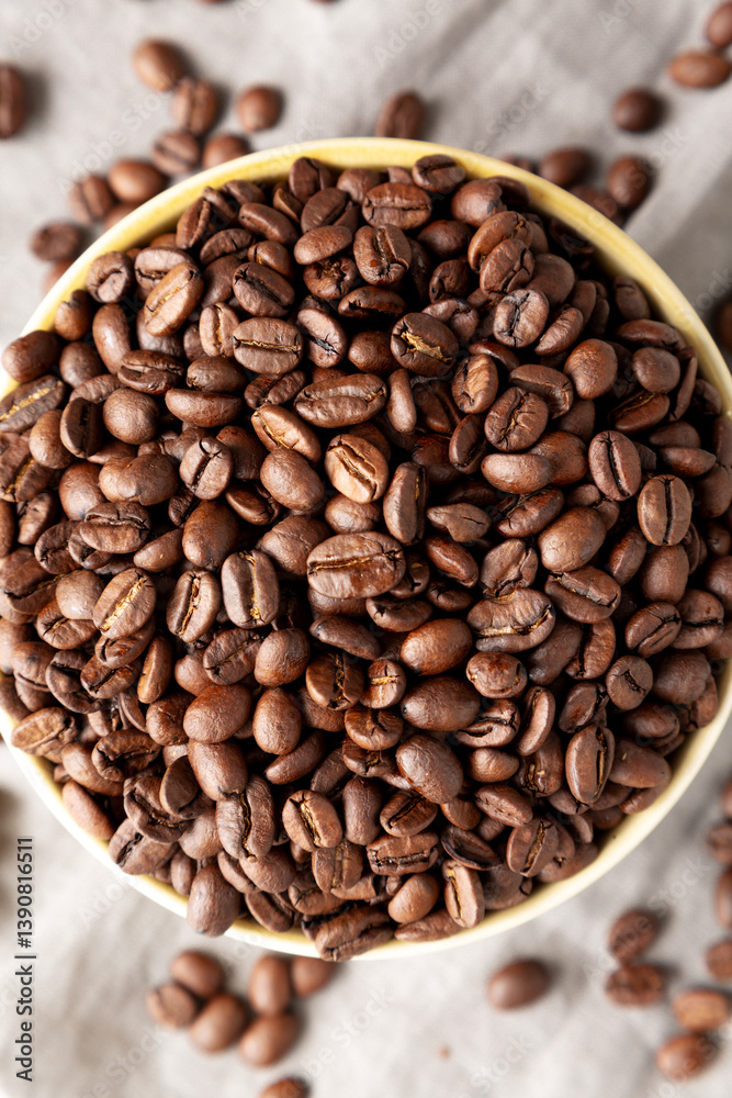 Fototapeta premium Organic Roasted Coffee Beans in a Bowl, top view.