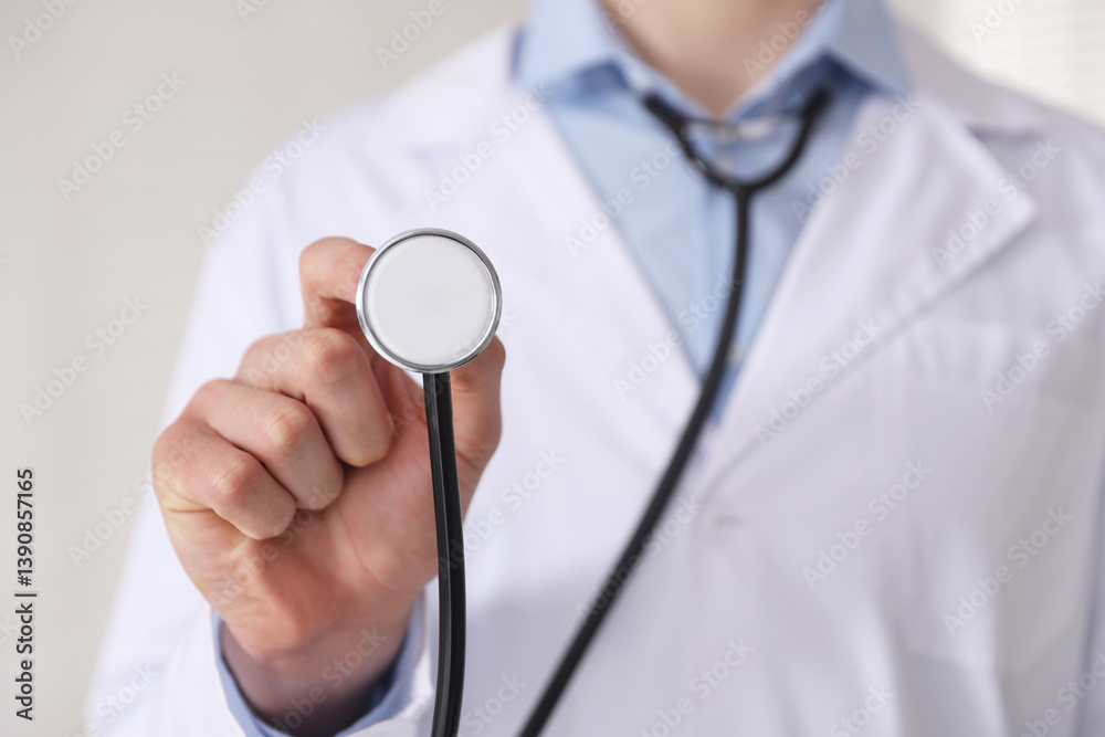 Doctor with stethoscope on light background, closeup Doctor with stethoscope on light background, closeup