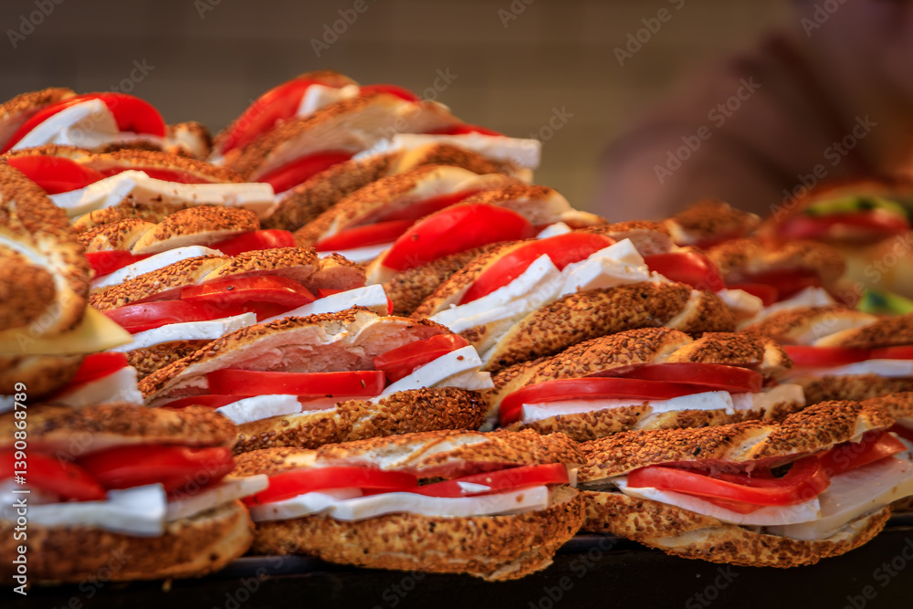 Simit sandwiches with cheese and tomato at a food stall in Istanbul, Turkey