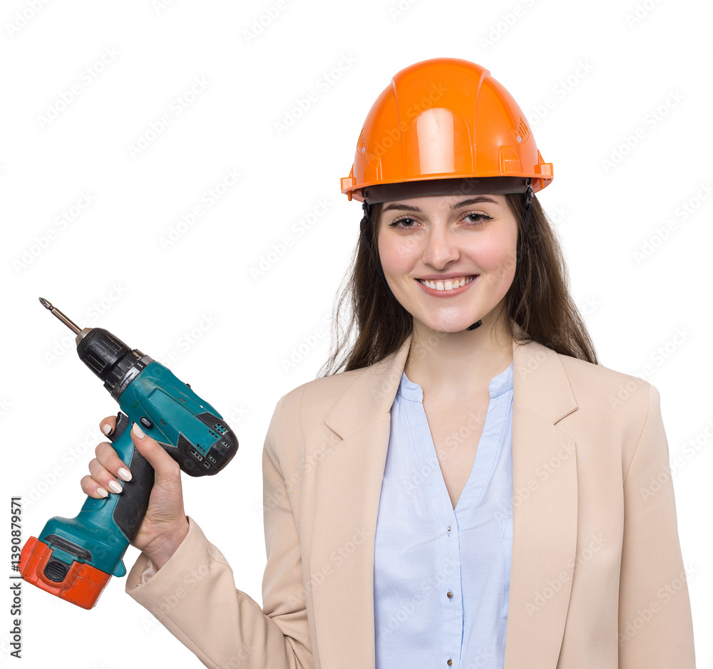 Girl engineer in an orange construction helmet with a screwdriver and a hammer on a white background. Girl engineer in an orange construction helmet with a screwdriver and a hammer on a white background.