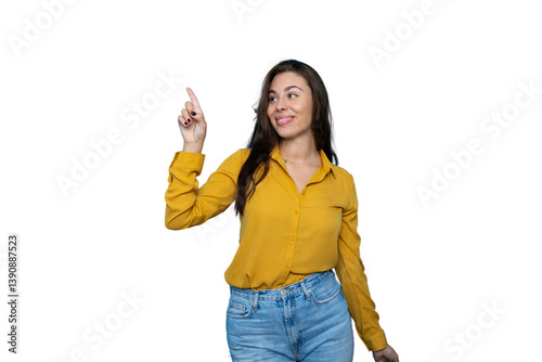 Cheerful woman in studio pointing finger playfully against transparent background, indicating copyspace