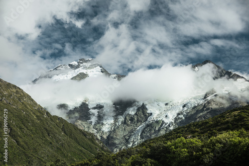 Snowy mountains in the clouds.