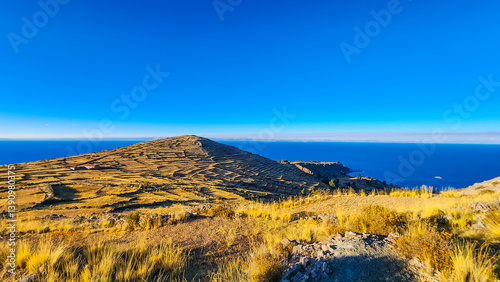 SUN REFLECTION OVER LAKE TITICACA FROM AMANTANÍ ISLAND, PERU – HIGH ANDES LANDSCAPE
