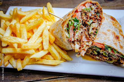grilled steak and cheese wraps with side of French fries and melted cheese inside.