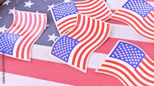 Zoom in some flag-themed stickers on American flag. Represents the essence of national pride, nation, economy and unit.