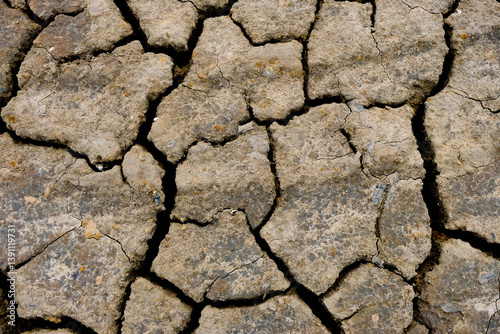 Wall texture soil dry crack pattern of drought lack of water of nature brown old broken background.