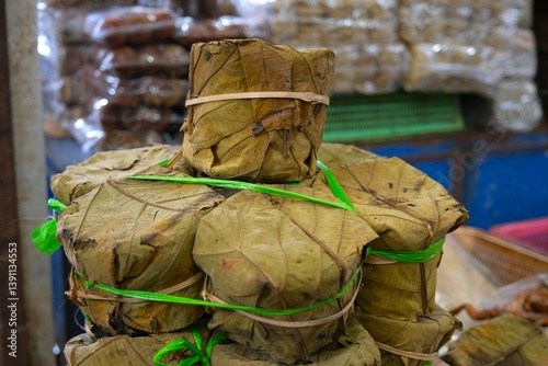 Konstfotografi Organic brown sugar or palm sugar wrapped in teak leaves