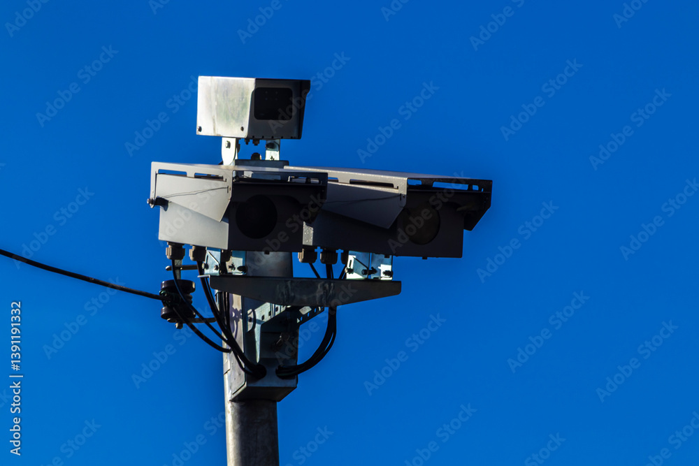 Urban surveillance and traffic monitoring cameras on metal poles in Brazil. Devices help improve public safety, vehicle control, and city management through smart technology.