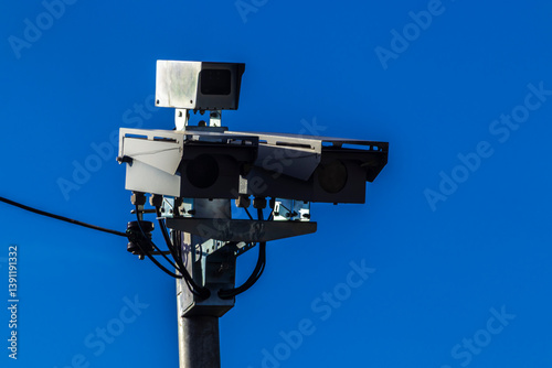 Obraz na płótnie Urban surveillance and traffic monitoring cameras on metal poles in Brazil. Devices help improve public safety, vehicle control, and city management through smart technology. w salonie