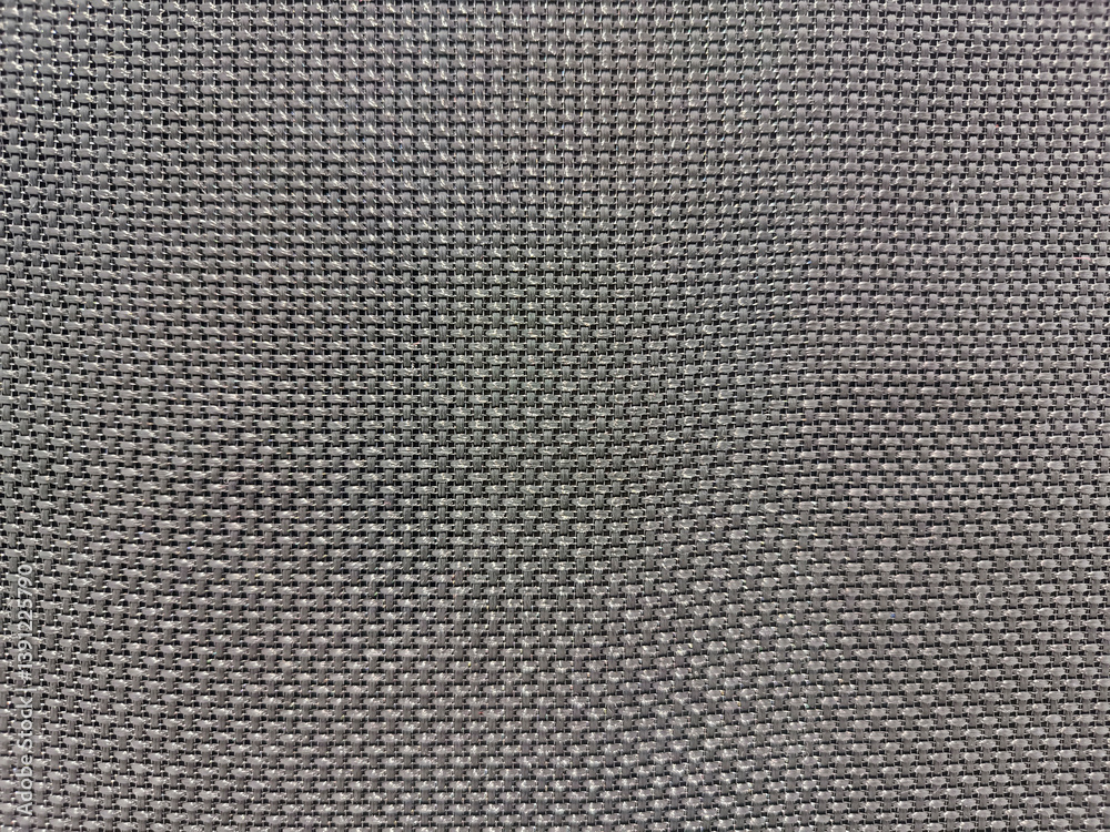 Black speaker surface texture. Macro. Woven mesh surface. metal grille, mesh speaker, dark fabric amplifier part. Speaker grille
