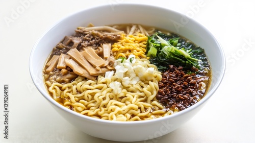 Plain white bowl of dan dan noodles with neatly arranged toppings