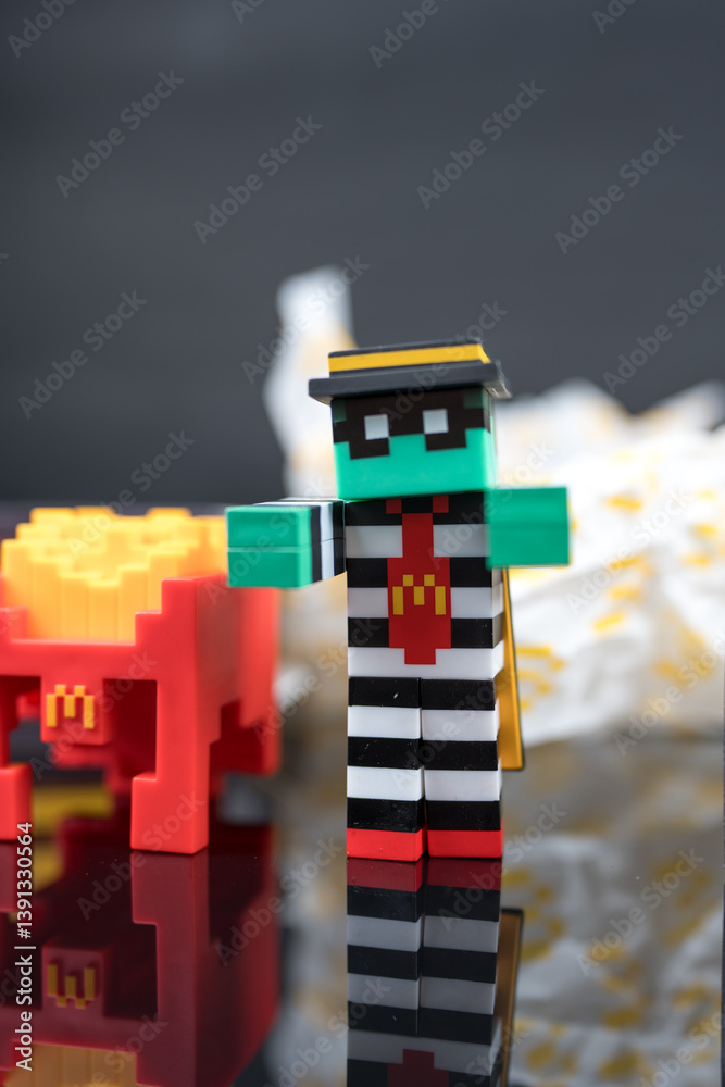 Fototapeta premium Bangkok, Thailand - April 8, 2025 : Zombie hamburglar and Minecraft fries helmet, Minecraft blind box from McDonald's collaborates