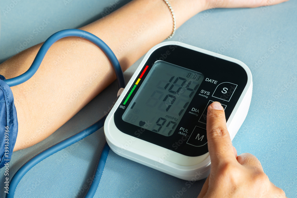 man check blood pressure monitor and heart rate monitor with digital pressure gauge. Health care and Medical concept