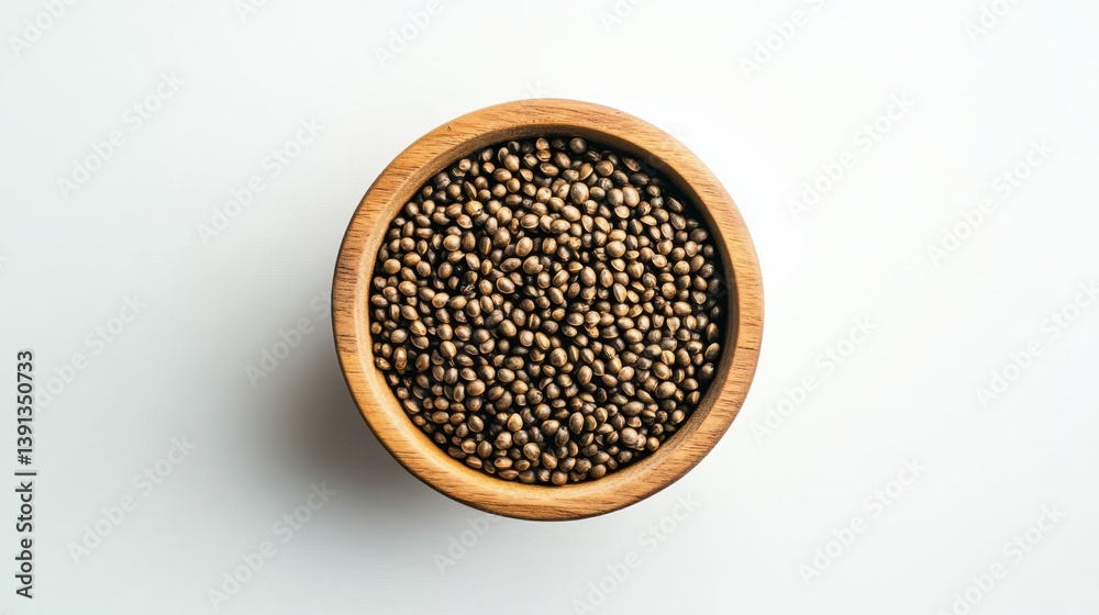 Hemp seeds in wooden bowl overhead shot on white background healthy eating plant based diet ingredient Hemp seeds in wooden bowl overhead shot on white background healthy eating plant based diet ingredient