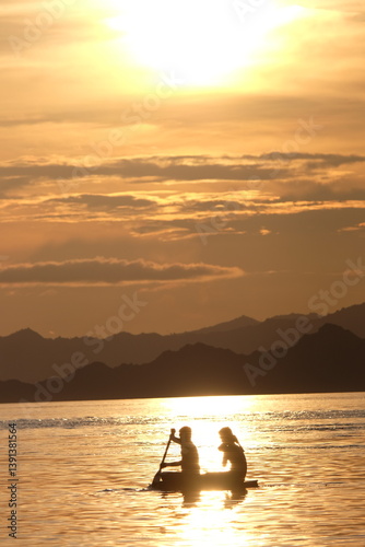 Beautiful sunset over the ocean in Labuan Bajo, Indonesia—serene tropical seascape with warm golden light and peaceful atmosphere.