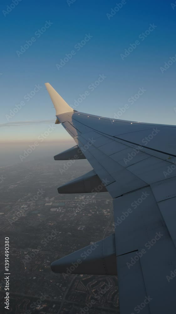 Vertical Screen: Experience a breathtaking airplane view of expansive skies filled with fluffy clouds as the aircraft glides smoothly, creating a mesmerizing sight that enchants every traveler Vertical Screen: Experience a breathtaking airplane view of expansive skies filled with fluffy clouds as the aircraft glides smoothly, creating a mesmerizing sight that enchants every traveler