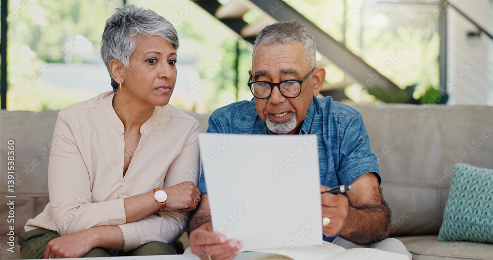 Discussion, documents and senior couple on sofa with stress for debt, mortgage or bills repayment. Talk, upset and elderly man with woman for conversation on retirement funds with paperwork in home Discussion, documents and senior couple on sofa with stress for debt, mortgage or bills repayment. Talk, upset and elderly man with woman for conversation on retirement funds with paperwork in home