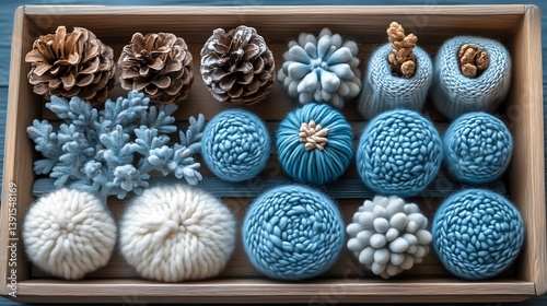 Winter-themed decorative items arranged in a wooden box.