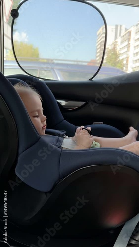 Wallpaper Mural Curious Baby in Car Seat Observing Hands Torontodigital.ca