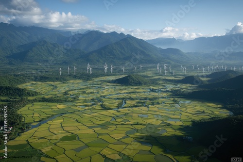 Vast rice paddies, wind turbines, and mountains