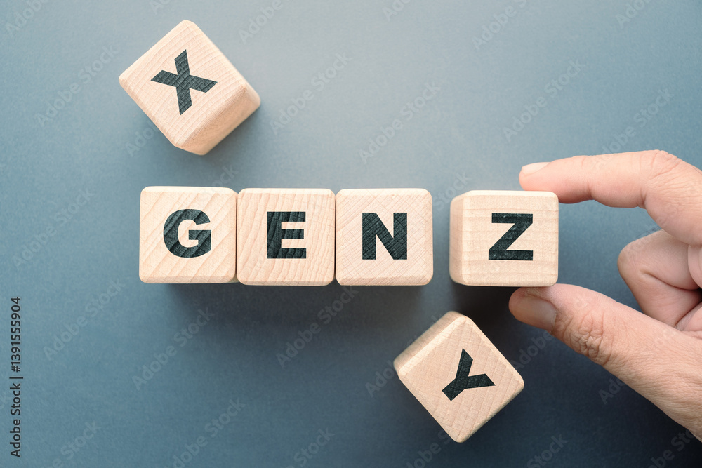 Obraz premium Hand arranges the alphabet wood cubes, concepts and understandings of Gen Z compared to Gen X and Gen Y