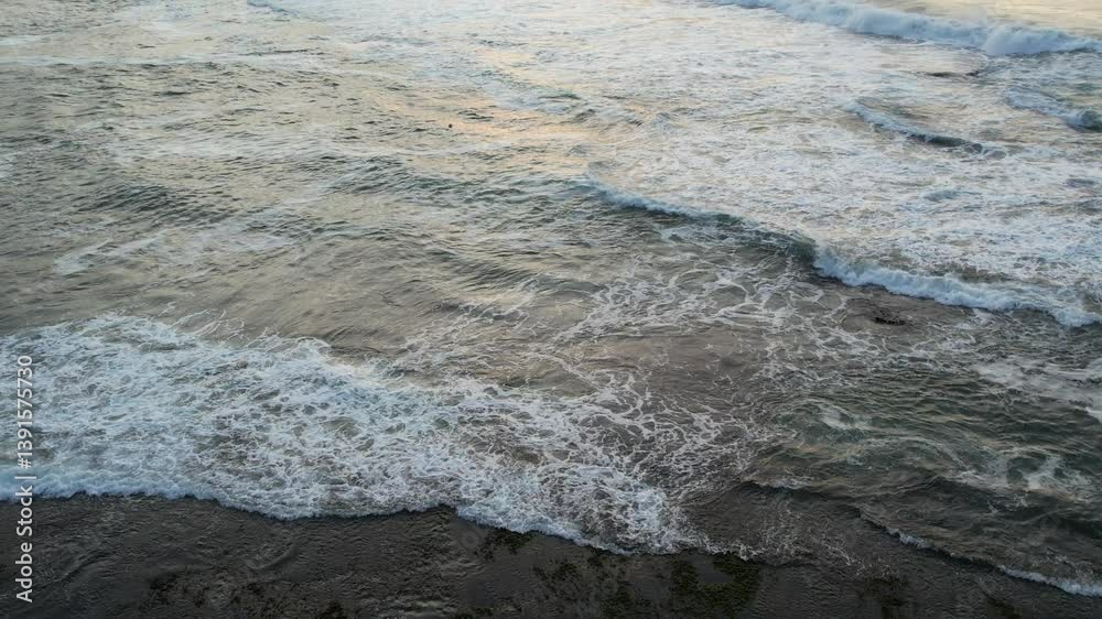 Aerial view of Puncak Guha Beach Garut Indonesia in the afternoon when the sun sets. The sound of the waves on the beach is very beautiful Aerial view of Puncak Guha Beach Garut Indonesia in the afternoon when the sun sets. The sound of the waves on the beach is very beautiful