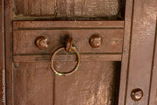 Obraz na płótnie Traditional Wooden Door of Bhunga Hut with Decorative Artwork in Rann of Kutch w salonie
