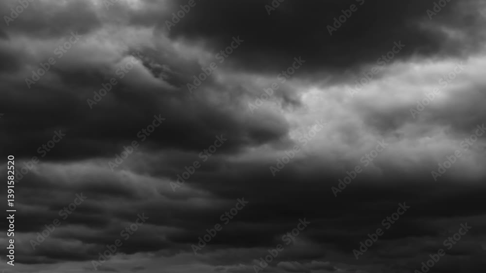 dark dramatic sky with black stormy clouds before rain as abstract background, extreme weather timelapse