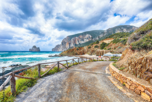 Attractive view of beach Portu Cauli in Masua with Pan di Zucchero at background.