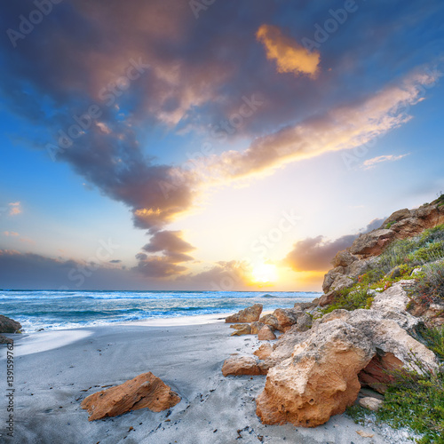 Obraz na płótnie Unbelivable view of sunset on beach Capo San Marco Oristano on Del Sinis peninsula. w salonie