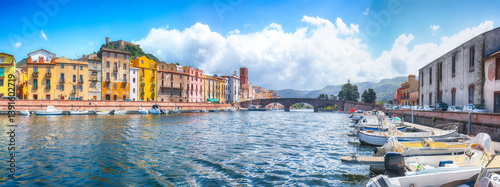 Obraz na płótnie Attractive cityscape of Bosa town with Ponte Vecchio bridge across the Temo river. w salonie