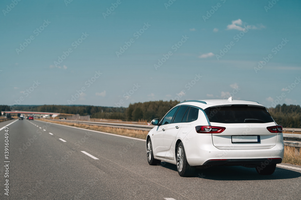 Rear view of station wagon on open highway