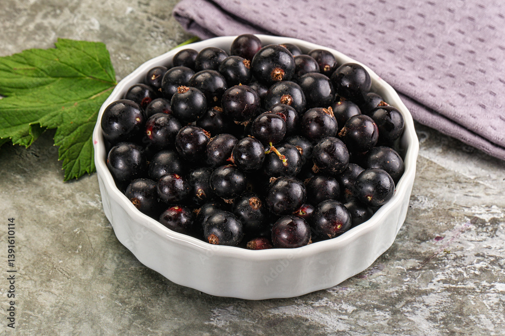Ripe black currant in the bowl Ripe black currant in the bowl