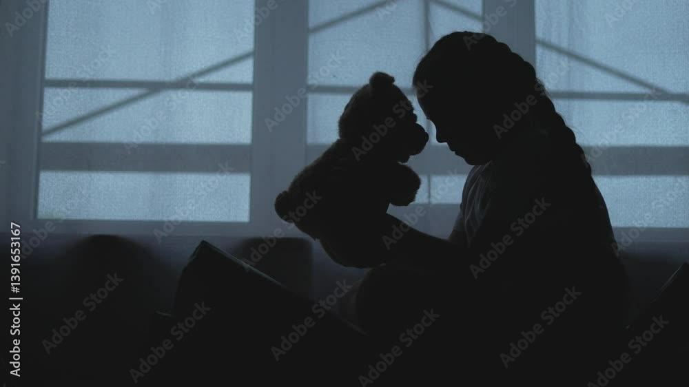 Depressed kid holding teddy bear indoors. Teddy bear brings comfort to sad child. Depressed kid with teddy seeking solace. Child finds solace in while sad. Sad depressed child embraces teddy bear. Depressed kid holding teddy bear indoors. Teddy bear brings comfort to sad child. Depressed kid with teddy seeking solace. Child finds solace in while sad. Sad depressed child embraces teddy bear.