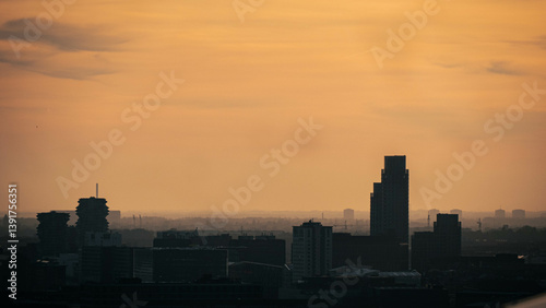 Photography Copenhagen sunset from above with beautiful golden sun colours and impressive cl