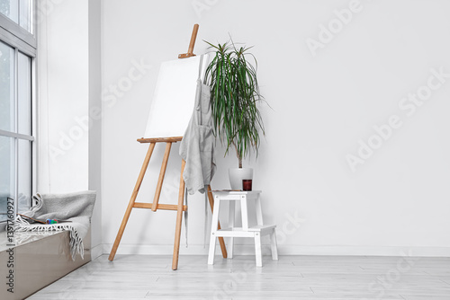 Wooden easel with blank can...