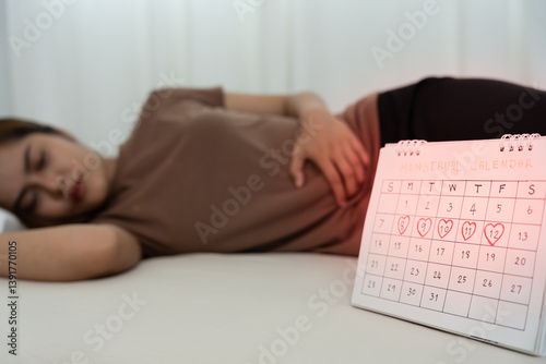 stomach ache. Asian women have abdominal pain, indigestion, gastritis, menstrual cramps, flatulence, diarrhea, distention, colon cancer, belly inflammation problem, suffer food poisoning, abdomen