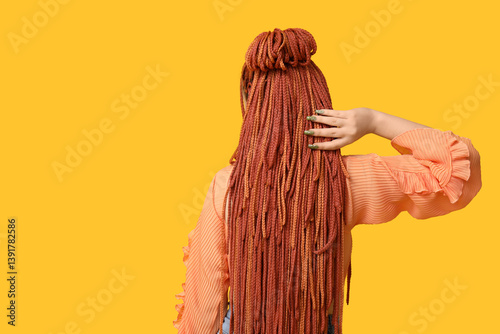 Young woman with dreadlocks...