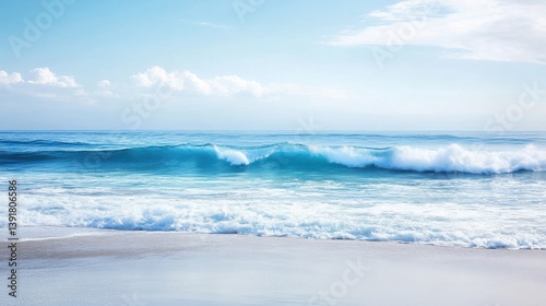 Serene Scene of Gentle Waves Lapping Against Sandy Shore Under Clear Blue Sky