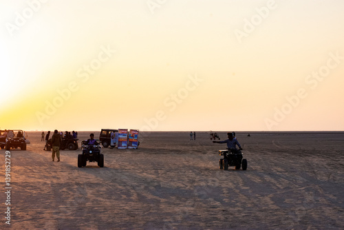Obraz na płótnie ATV Biking Adventure at Sunset in White Desert of Rann of Kutch w salonie