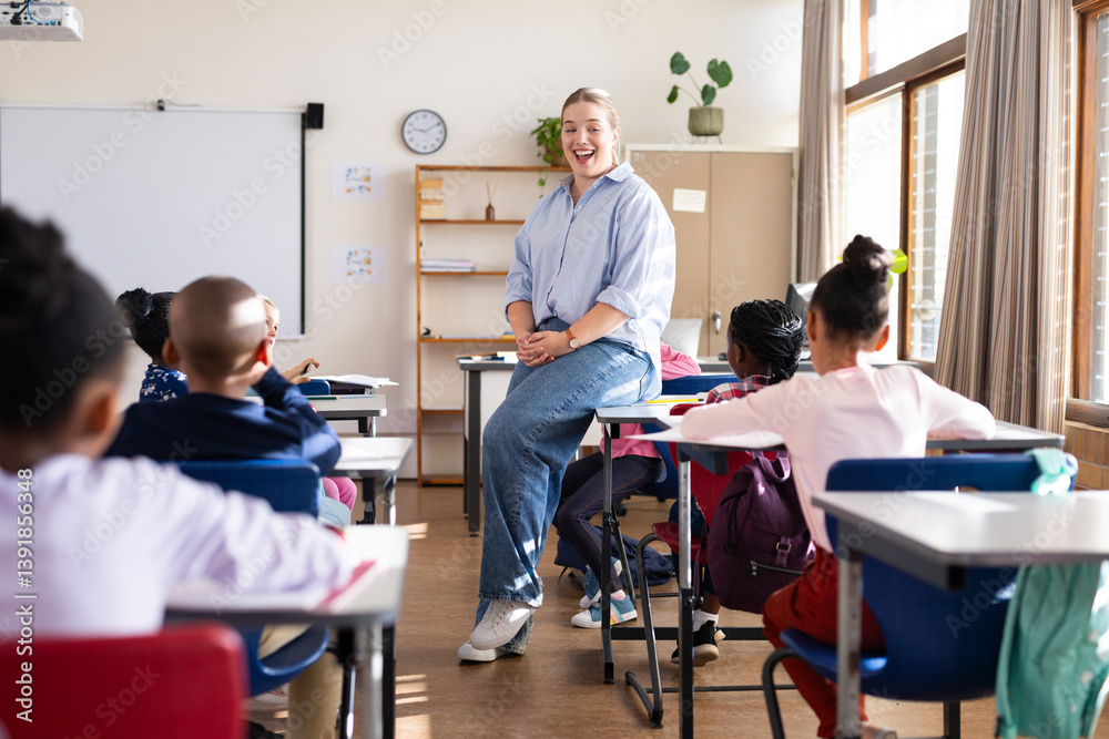 Obraz premium Engaging with diverse students, female teacher fostering interactive learning in classroom at school