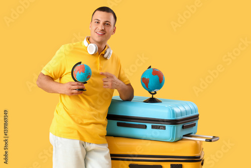 Male tourist with globes an...