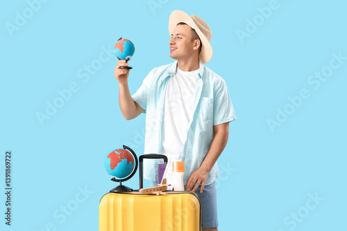 Male tourist with globes an...