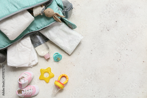 Baby bag with pacifier on white background. Top view