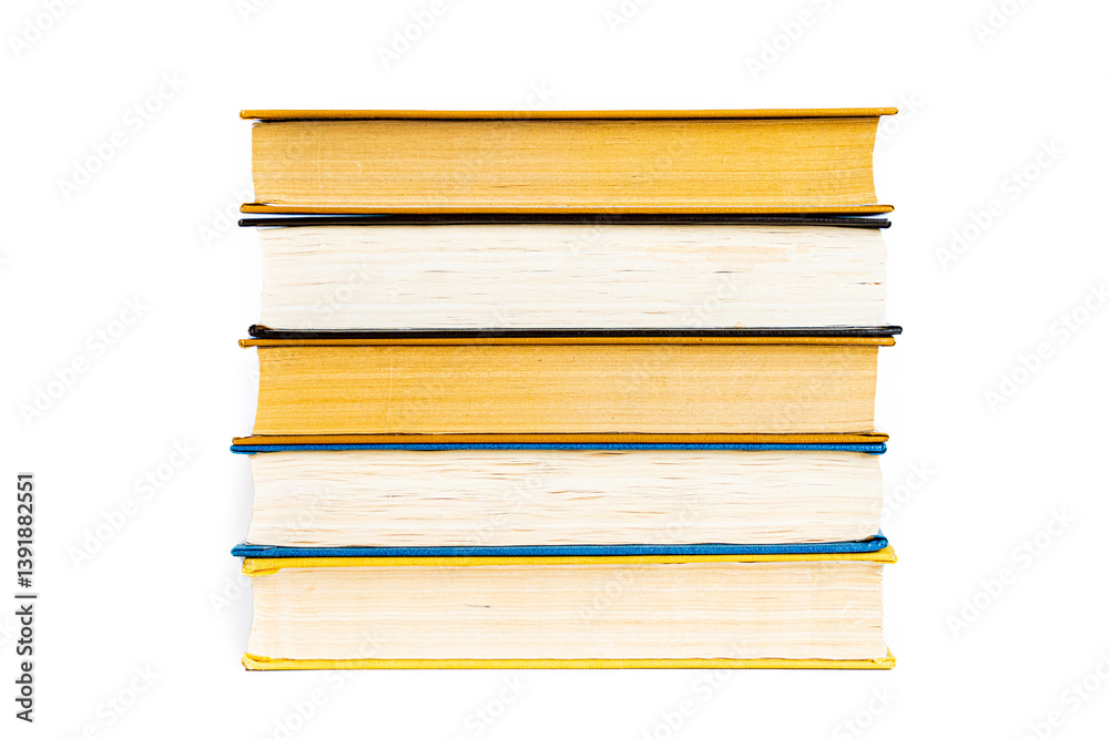 stack a large pile of printed books lies on the table, book covers and pages for study