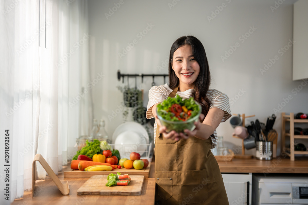 Portrait of Asian woman cooking green healthy salad in kitchen at home. Portrait of Asian woman cooking green healthy salad in kitchen at home.