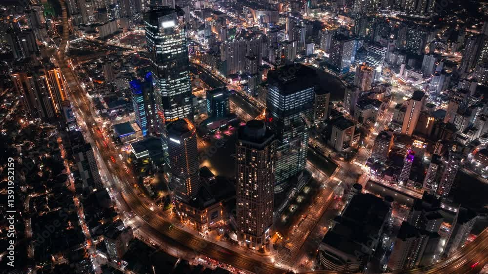 Aerial hyperlapse of skyscrapers and traffic in downtown Busan, Seomyeon district in South Korea at night